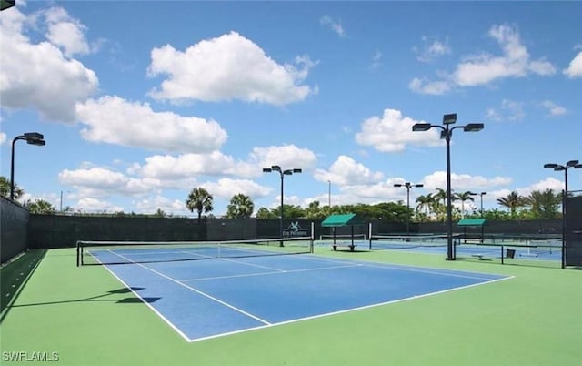 view of tennis court featuring basketball court