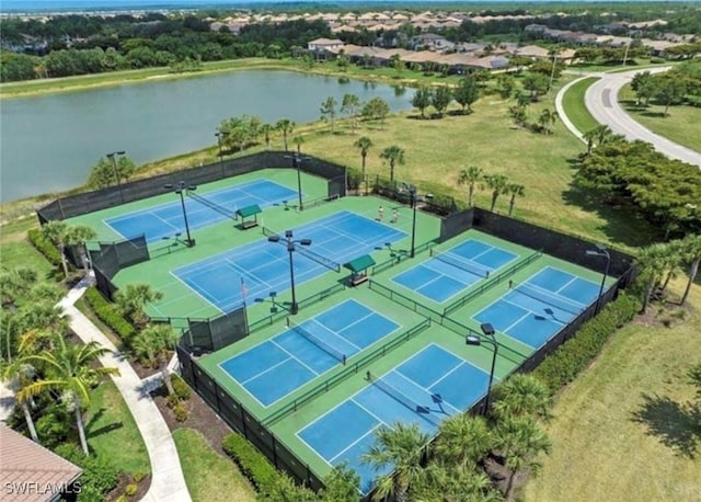 birds eye view of property with a water view