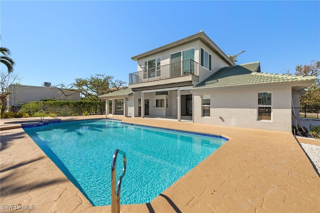 view of swimming pool featuring a patio