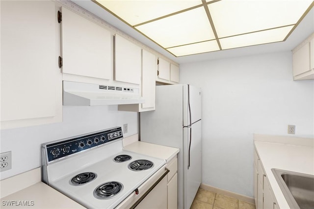 kitchen with white cabinetry, sink, and white appliances