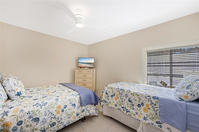 bedroom with light tile patterned flooring and ceiling fan