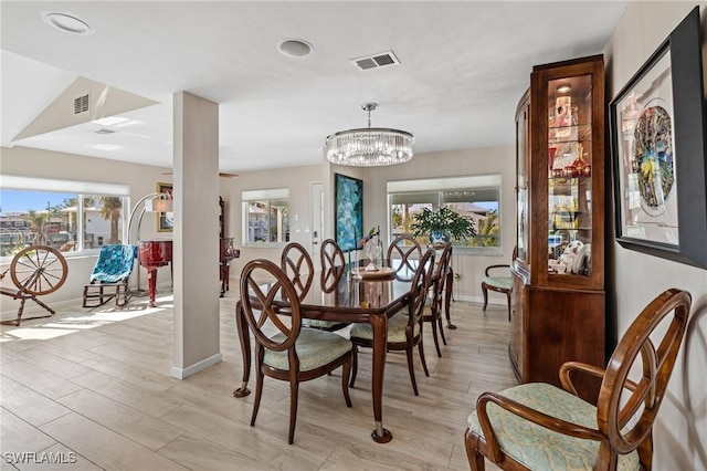 291 Flamingo St, Fort Myers Beach, FL 33931 - dining room featuring baseboards, visible vents, light wood-style floors, and an inviting chandelier