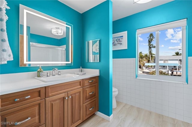 291 Flamingo St, Fort Myers Beach, FL 33931 - full bathroom with tile walls, toilet, a shower, and vanity