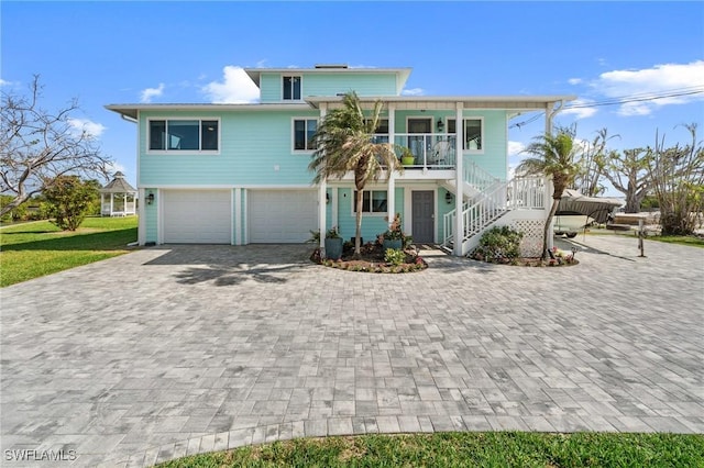 view of front of property with a porch and a garage