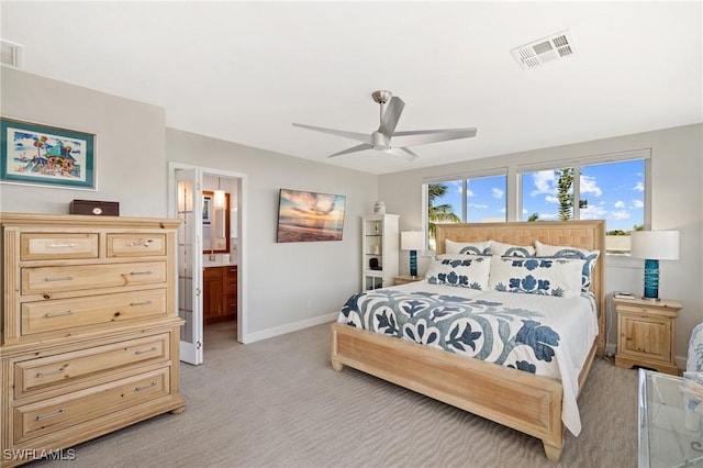 291 Flamingo St, Fort Myers Beach, FL 33931 - bedroom with light colored carpet, baseboards, connected bathroom, visible vents, and a ceiling fan
