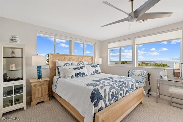 carpeted bedroom with ceiling fan