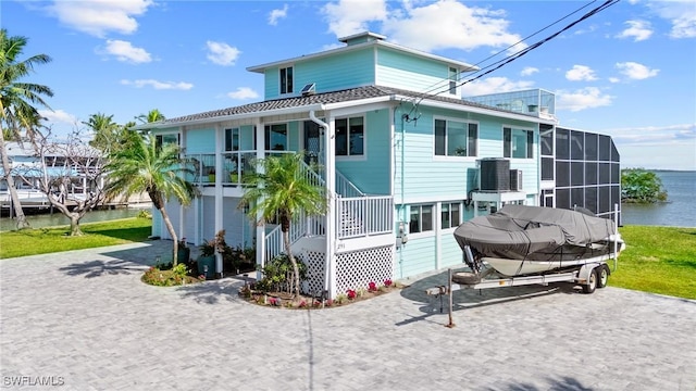 rear view of property featuring a water view