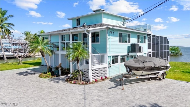 291 Flamingo St, Fort Myers Beach, FL 33931 - rear view of property featuring a water view, a porch, and stairway