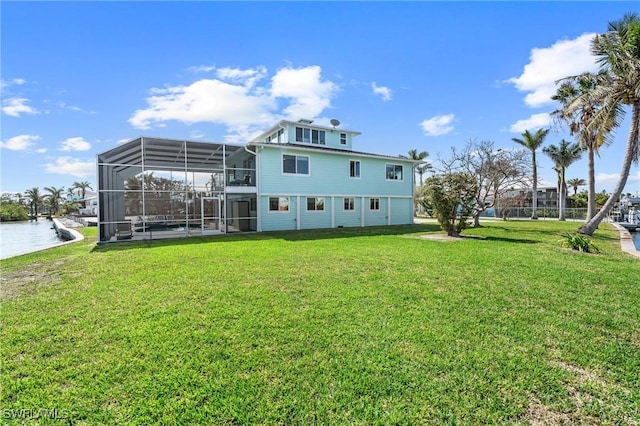 291 Flamingo St, Fort Myers Beach, FL 33931 - back of house with a lawn and a lanai