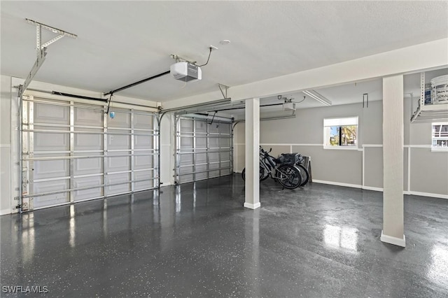 291 Flamingo St, Fort Myers Beach, FL 33931 - garage featuring baseboards and a garage door opener