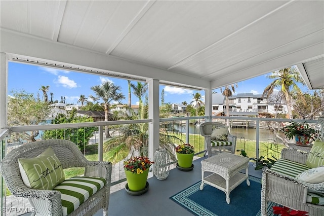 sunroom with a water view