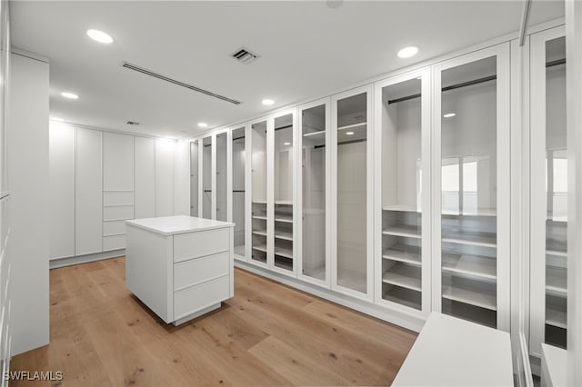 walk in closet featuring light hardwood / wood-style floors