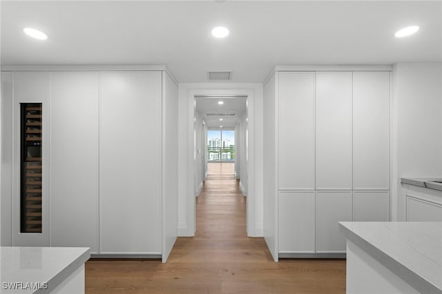 hallway with light wood-type flooring