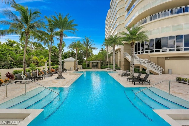 view of swimming pool with a patio