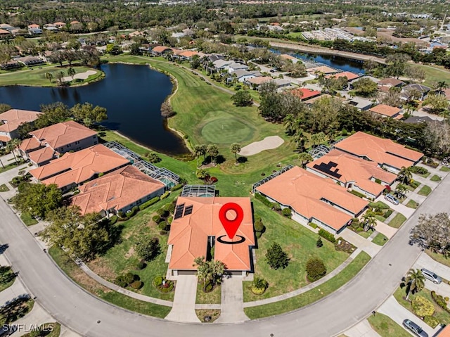 birds eye view of property with a residential view, a water view, and golf course view