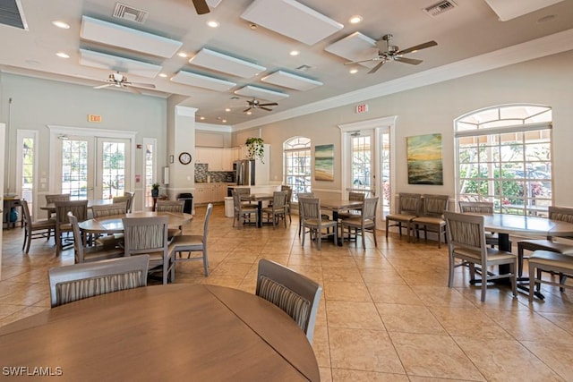 dining room featuring french doors, visible vents, and a healthy amount of sunlight