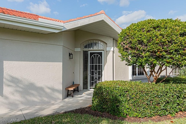 2081 Crestview Way, Naples, FL 34119 - property entrance featuring stucco siding