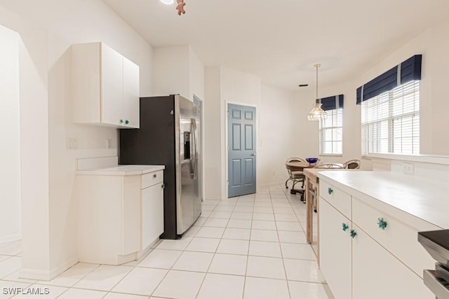2081 Crestview Way, Naples, FL 34119 - kitchen featuring stainless steel fridge with ice dispenser, light countertops, and white cabinets