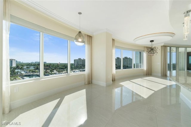 interior space featuring a view of city, baseboards, a chandelier, and crown molding