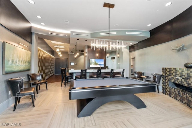 game room with recessed lighting, billiards, and a tile fireplace