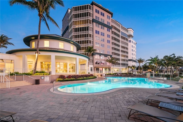 community pool with a patio area