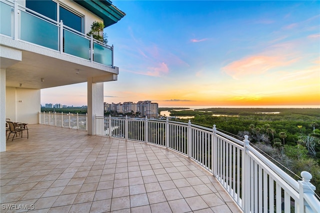 view of balcony at dusk