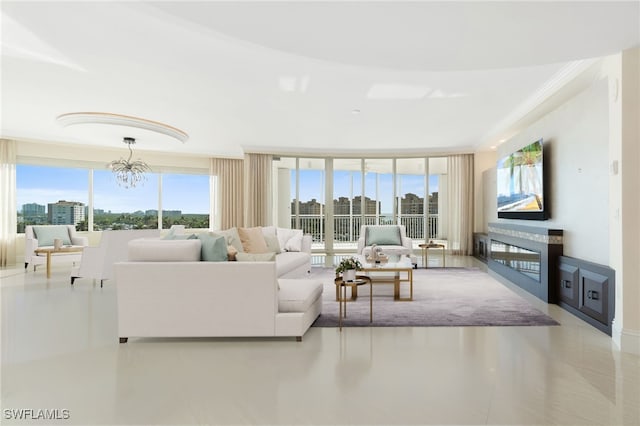 living area featuring crown molding and a notable chandelier