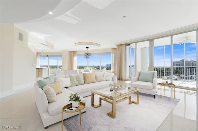 living room with a chandelier, a wealth of natural light, crown molding, and baseboards