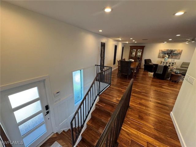 stairway featuring hardwood / wood-style flooring