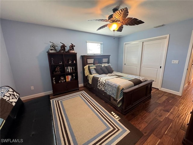 bedroom with ceiling fan, dark hardwood / wood-style flooring, and a closet