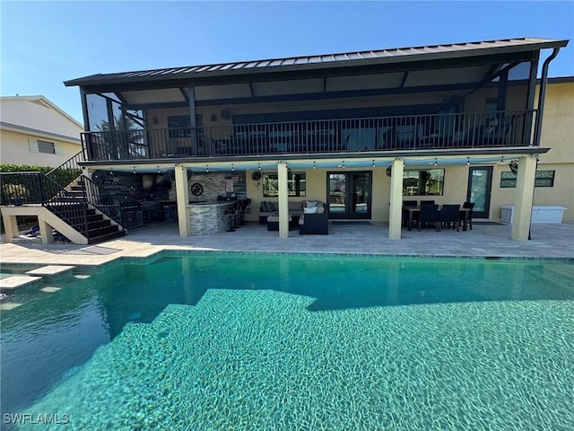 view of swimming pool with an outdoor hangout area, a patio, and an outdoor bar