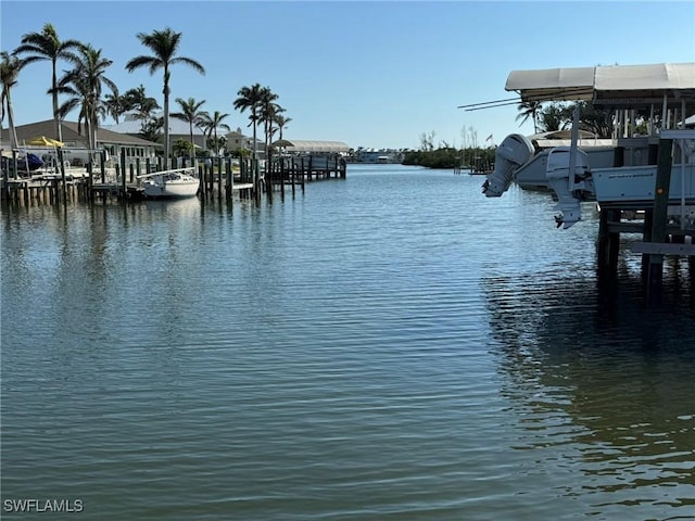 property view of water with a dock