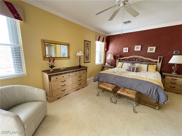 bedroom with light carpet, crown molding, and ceiling fan