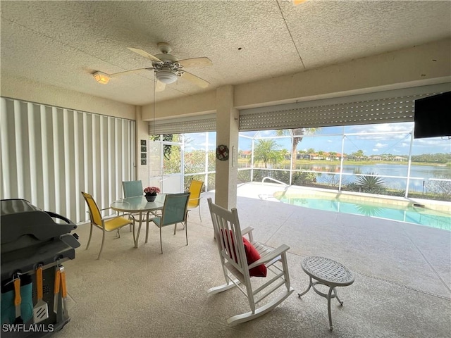 sunroom / solarium with ceiling fan