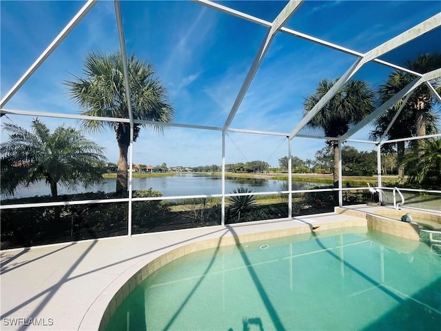 view of swimming pool featuring a water view and a lanai