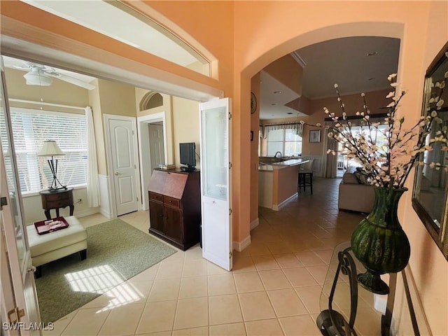 corridor featuring light tile patterned floors