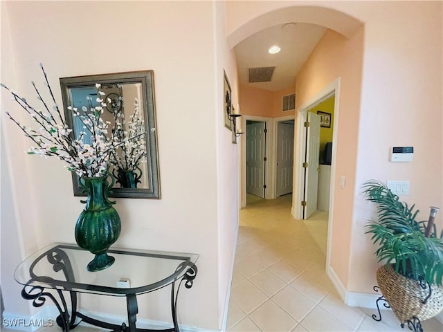 hallway featuring light tile patterned flooring