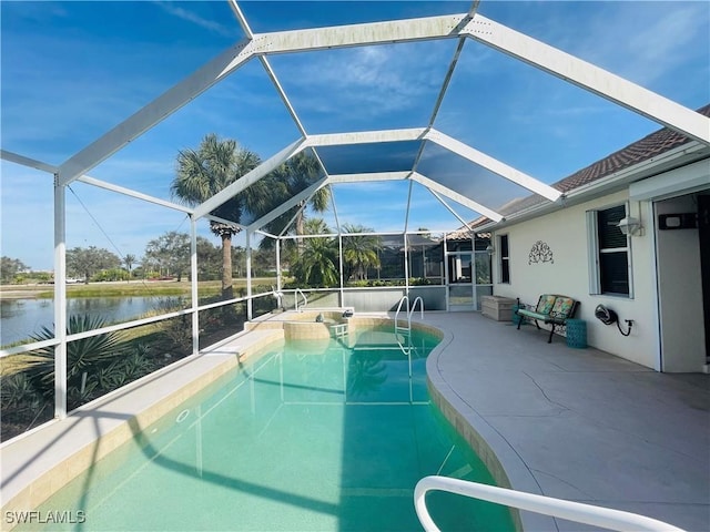 view of swimming pool featuring a patio, a water view, and glass enclosure