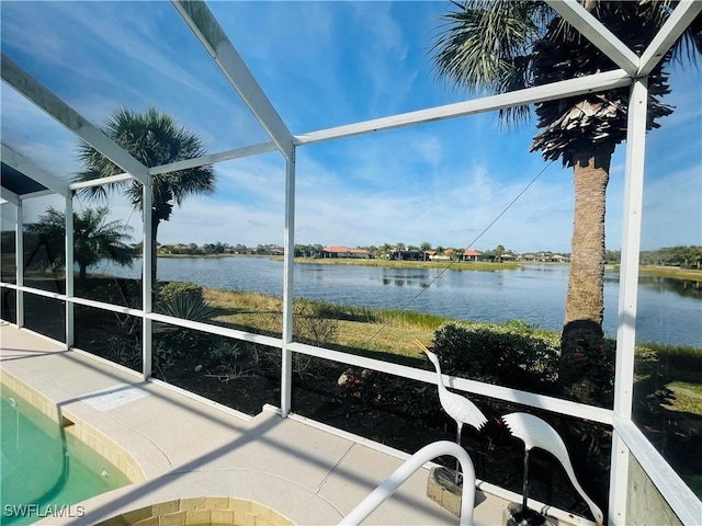 unfurnished sunroom with a water view and a healthy amount of sunlight