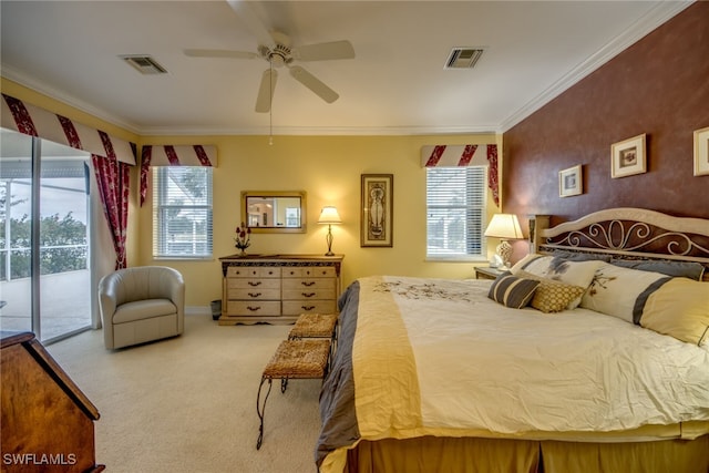 carpeted bedroom with access to exterior, ceiling fan, visible vents, and ornamental molding