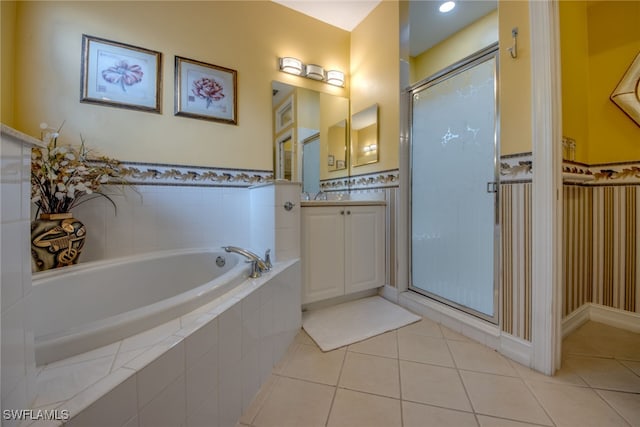 full bathroom with a bath, tile patterned flooring, vanity, and a shower stall