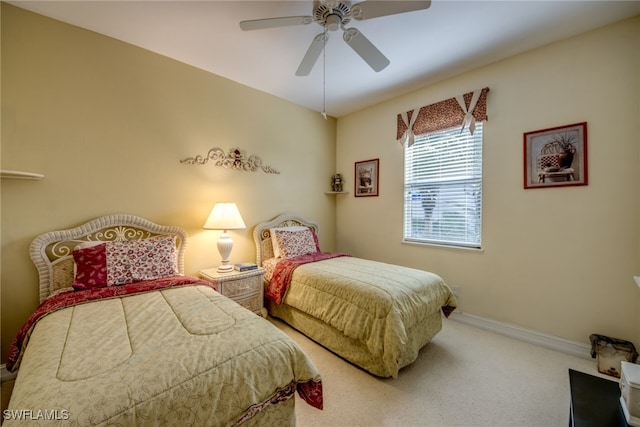 bedroom with ceiling fan, carpet floors, and baseboards