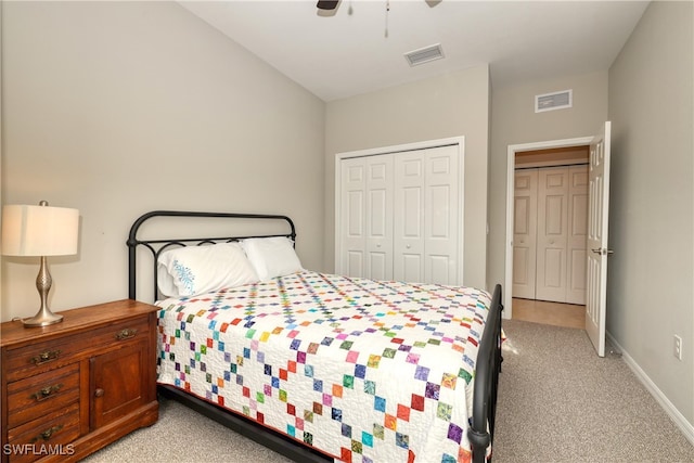 bedroom featuring ceiling fan, light colored carpet, and a closet