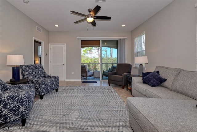 living room featuring light tile patterned flooring and ceiling fan