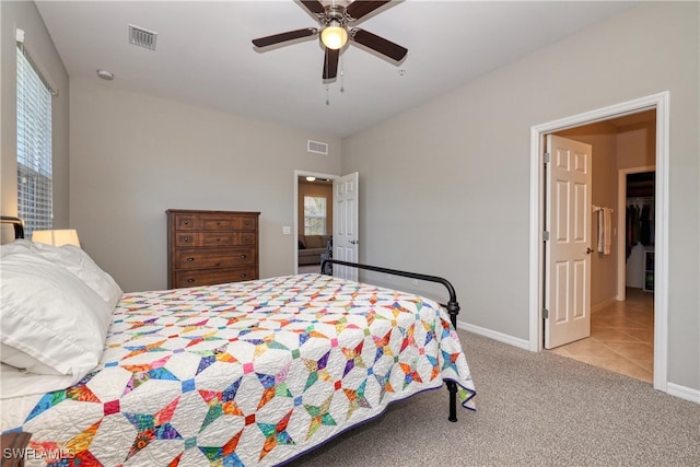 bedroom featuring ceiling fan and light carpet