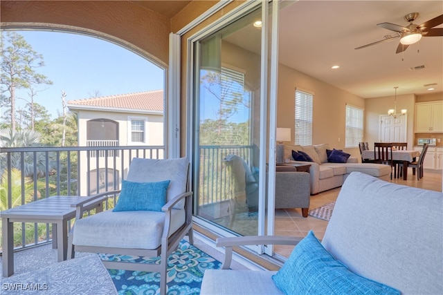 balcony featuring an outdoor hangout area and ceiling fan