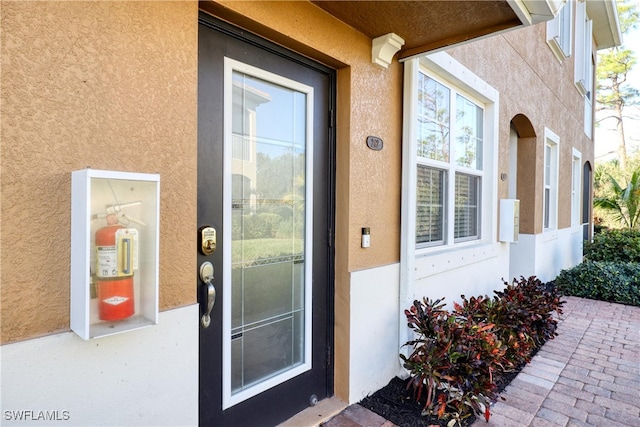 entrance to property featuring a patio