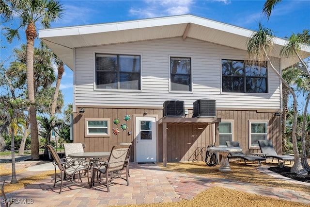 back of house featuring central AC and a patio area