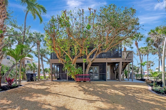 view of front of property with a sunroom