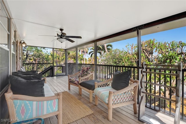 sunroom / solarium featuring ceiling fan and plenty of natural light